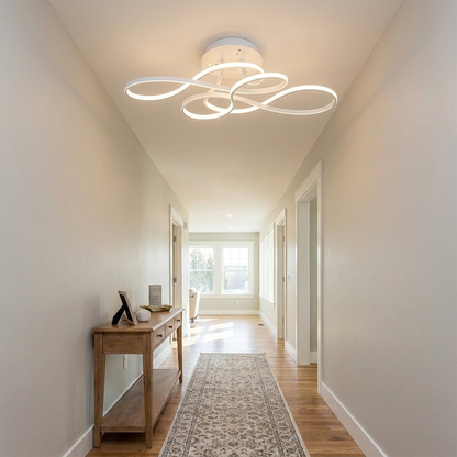 Lisse white curved ribbon ceiling light in a hallway