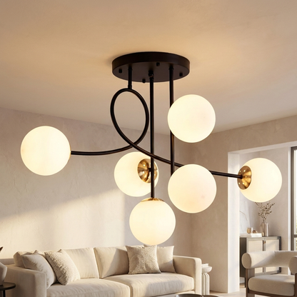Lenore black chandelier with milk white globes in a contemporary living room