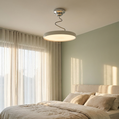 Vireo white disc semi flush ceiling light in a calm bedroom