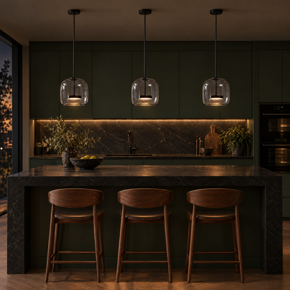 Three Orbe Hand Blown Glass Pendant Lights in Black and Smoke Grey over a kitchen island