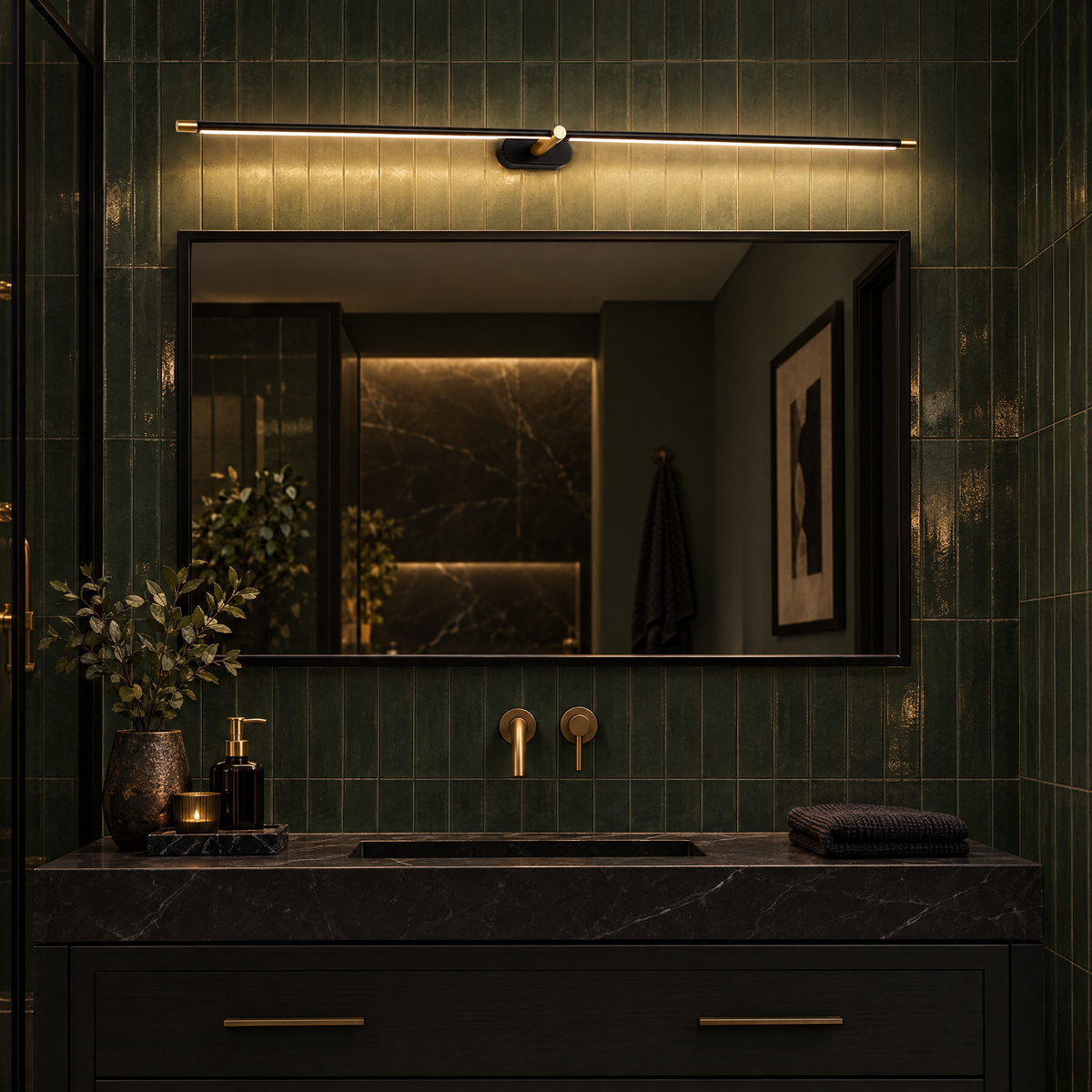 Strata Linear LED Vanity Wall Light in Black and Gold in a moody green bathroom
