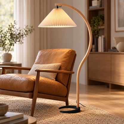 Caprani Beech Wood Linen Floor Lamp with Beige shade, close-up over a lounge chair
