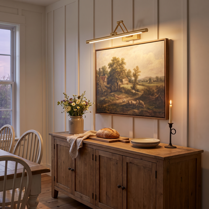 Brillan Model B gold LED picture light in a farmhouse dining room
