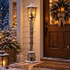 Hearthway wooden Christmas street lamp beside a farmhouse front door