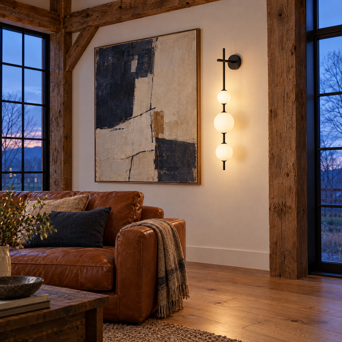 Kaskade globe wall sconce in black with 3 globes in an Upstate New York barn conversion living room