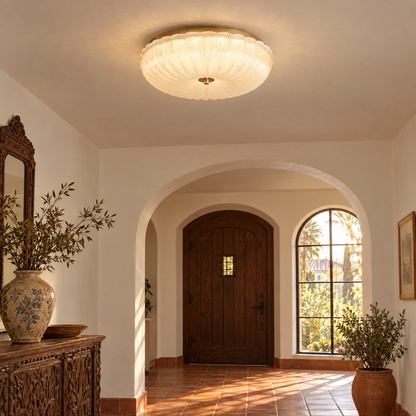 Givre ceiling light in frosted glass with gold trim in a California Spanish Revival entryway