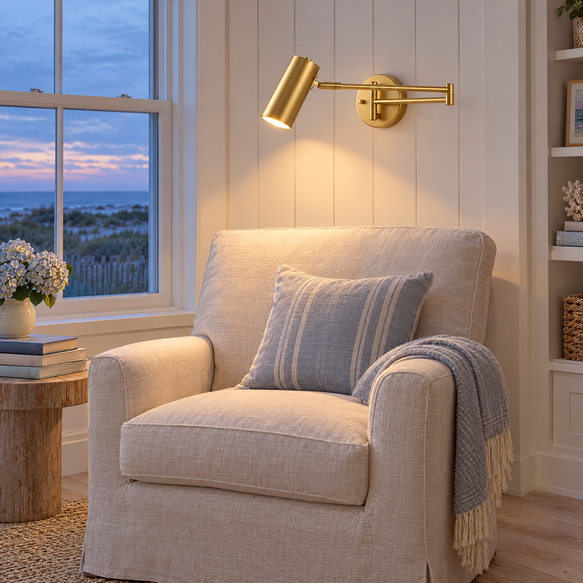 Tilda swing arm wall sconce in gold in a Hamptons beach house reading nook