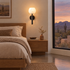 Mian alabaster flower wall sconce in black beside the bed in an Arizona desert modern bedroom