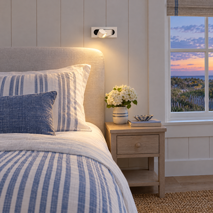 Lectra bedside reading wall light in matte white in a Hamptons shingle-style beach house guest bedroom