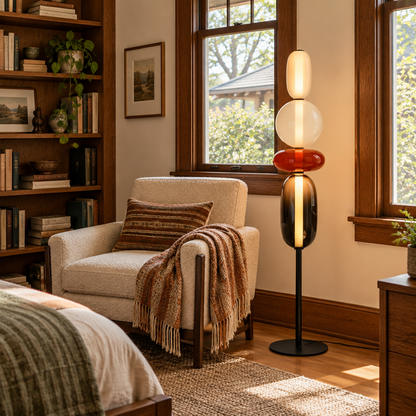 Bijou glass floor lamp in red in a bedroom reading corner