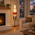 Bijou glass floor lamp in red in a living room with fireplace