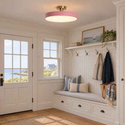 Tuva Flush Mount LED Ceiling Light, Pink, in a coastal New England cottage entryway with beadboard and a bench