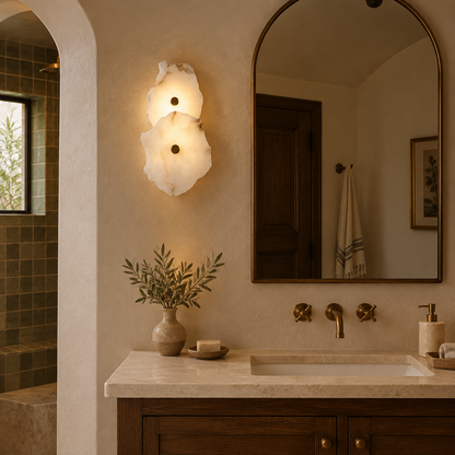 Kaia Alabaster LED Wall Sconce, 2 Lights, in a Southern California Spanish bungalow bathroom with a vanity and arched mirror