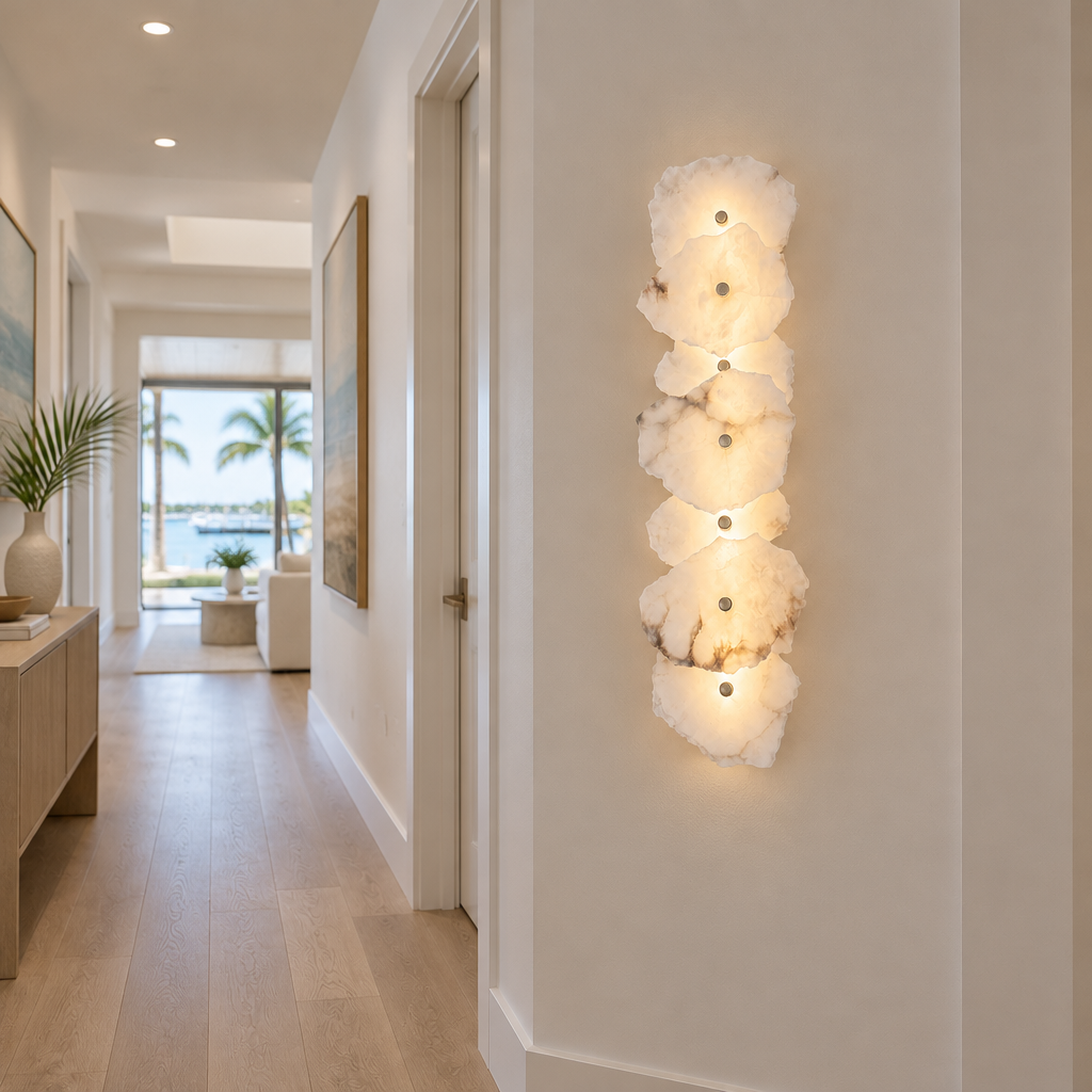 Kaia Alabaster LED Wall Sconce, 7 Lights, in a Florida modern home hallway with light wood floors and white walls