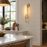 Odalys Brass Ribbed Glass Wall Sconce, Brass and clear glass, in a modern farmhouse kitchen with a white quartz island and shiplap walls