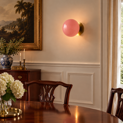 Wisp Glass Wall Sconce, Gold and Pink, in a colonial style dining room with wainscoting and a mahogany table