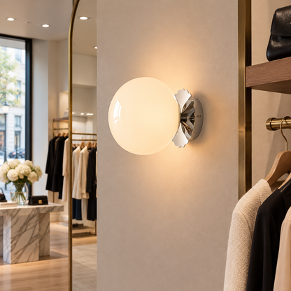 Wisp Glass Wall Sconce, Chrome and White, in a boutique clothing store in a U.S. shopping district