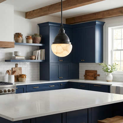 Gisele black pendant light over a white quartz kitchen island in a modern farmhouse with navy cabinets