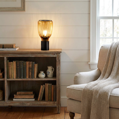 Verra amber table lamp on a bookshelf in a cozy Cape Cod reading room