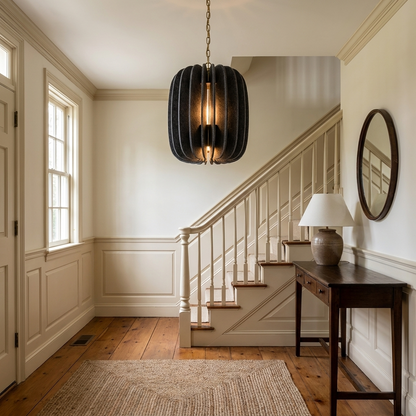Lamelle oval graphite pendant light in the entry foyer of a colonial style home