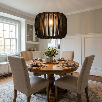 Lamelle round graphite pendant light above a round oak dining table in a transitional suburban home