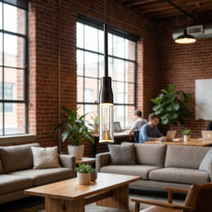 Capeline slim pendant light in a coworking space lounge with brick walls and big windows