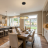 Orbita single ring 15.7 inch chandelier above a dining table in an open plan transitional suburban home