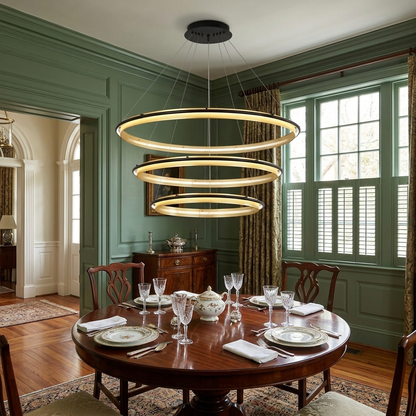 Orbita 3 tier small chandelier over a round pedestal table in a Charleston single house dining room