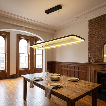 Orbita linear 47 inch chandelier above a dining table in a Brooklyn brownstone parlor