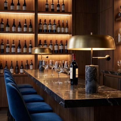 Barclay marble table lamp with gold dome shade on a marble bar counter in a wine bar