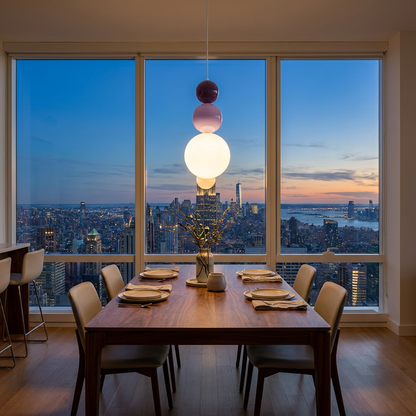Trilla three ball acrylic pendant light over a dining table in a Manhattan apartment