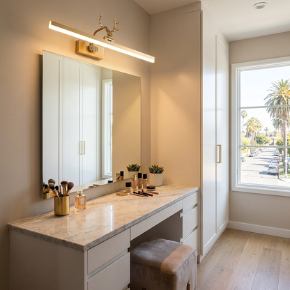 Cervo gold linear LED wall lamp above a vanity mirror in a dressing room