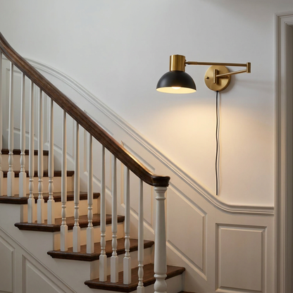 Swivo plug in swing arm wall lamp on a staircase wall