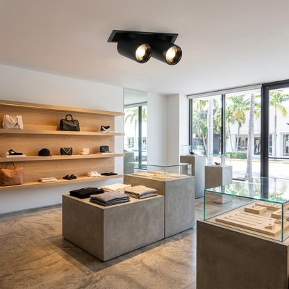 Cielo double head black adjustable recessed LED spotlight in a retail store ceiling