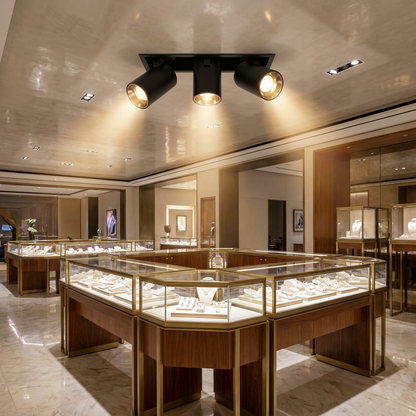 Cielo triple head black adjustable recessed LED spotlight in a jewelry store ceiling