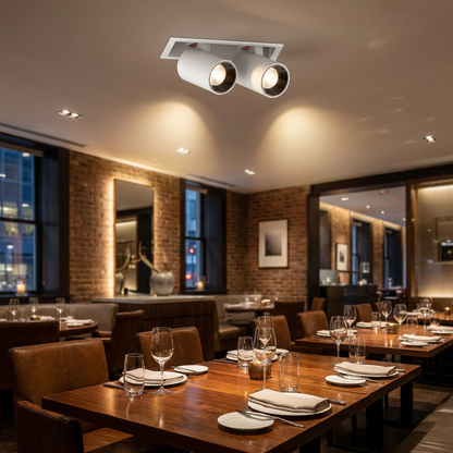 Cielo double head white adjustable recessed LED spotlight in a restaurant ceiling