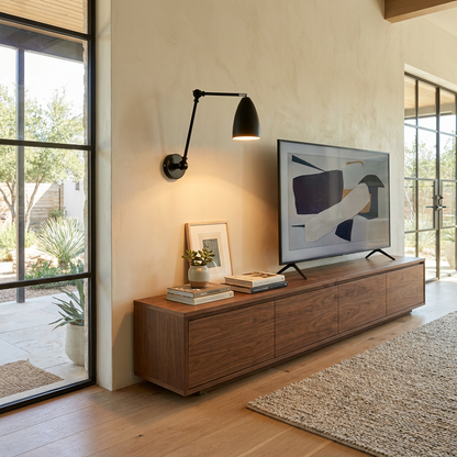 Bennett black double swing arm wall sconce in a modern Austin living room