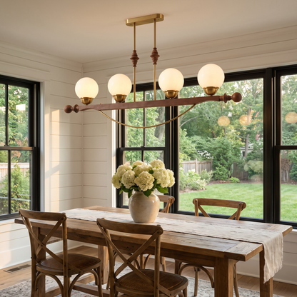Verdane walnut and gold linear chandelier in a farmhouse dining room