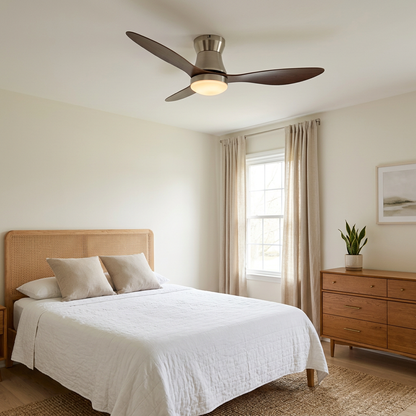 Dorae walnut and nickel ceiling fan light above a bed in a guest bedroom