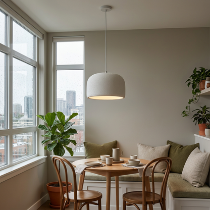 Maelis resin dome pendant light in White over an apartment dining nook