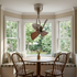 Cyrene walnut articulated ceiling fan above a breakfast nook table