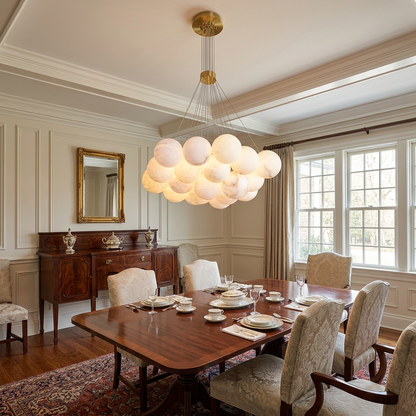 Alix alabaster ball cluster chandelier, 19 lights gold, in a formal dining room of a Colonial-style house in Greenwich, Connecticut