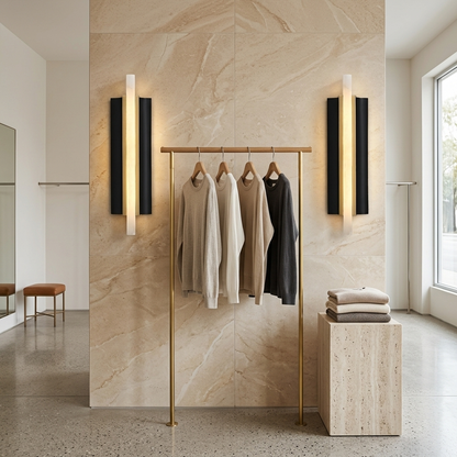 Amelie black blade alabaster wall sconces in a boutique clothing store