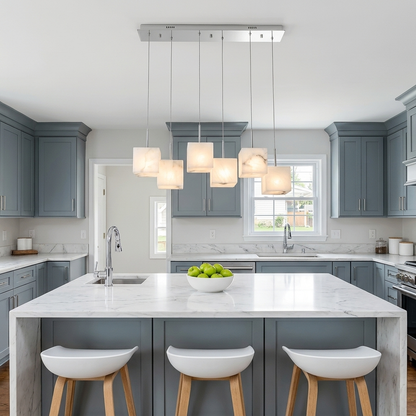 Ariane 6-light linear alabaster cube chandelier in silver over a suburban kitchen island
