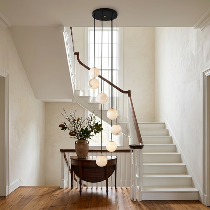 Amadine 7-light alabaster sphere cluster chandelier in a colonial house stairwell