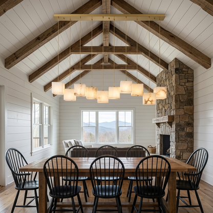 Ariane 10-light linear alabaster cube chandelier in gold over an Asheville farmhouse dining table