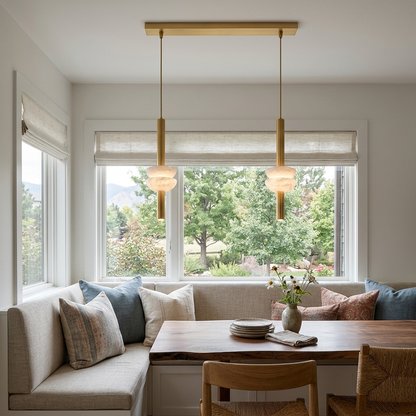 Brontee 2-light linear alabaster pendant in gold over a Denver home dining nook