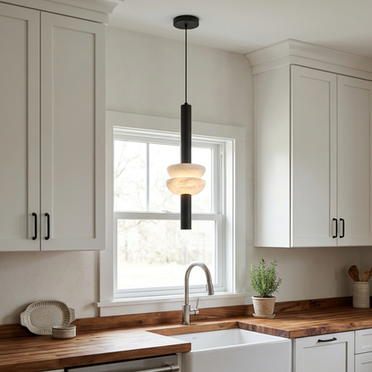 Brontee single alabaster column pendant in black above an Ohio farmhouse kitchen sink