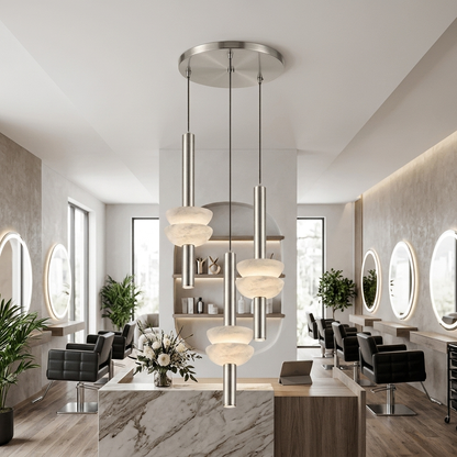 Brontee 3-light round alabaster pendant in nickel above a Houston salon reception desk