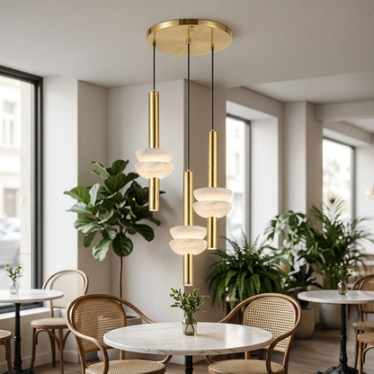 Brontee 3-light round alabaster pendant in gold over a San Diego cafe table